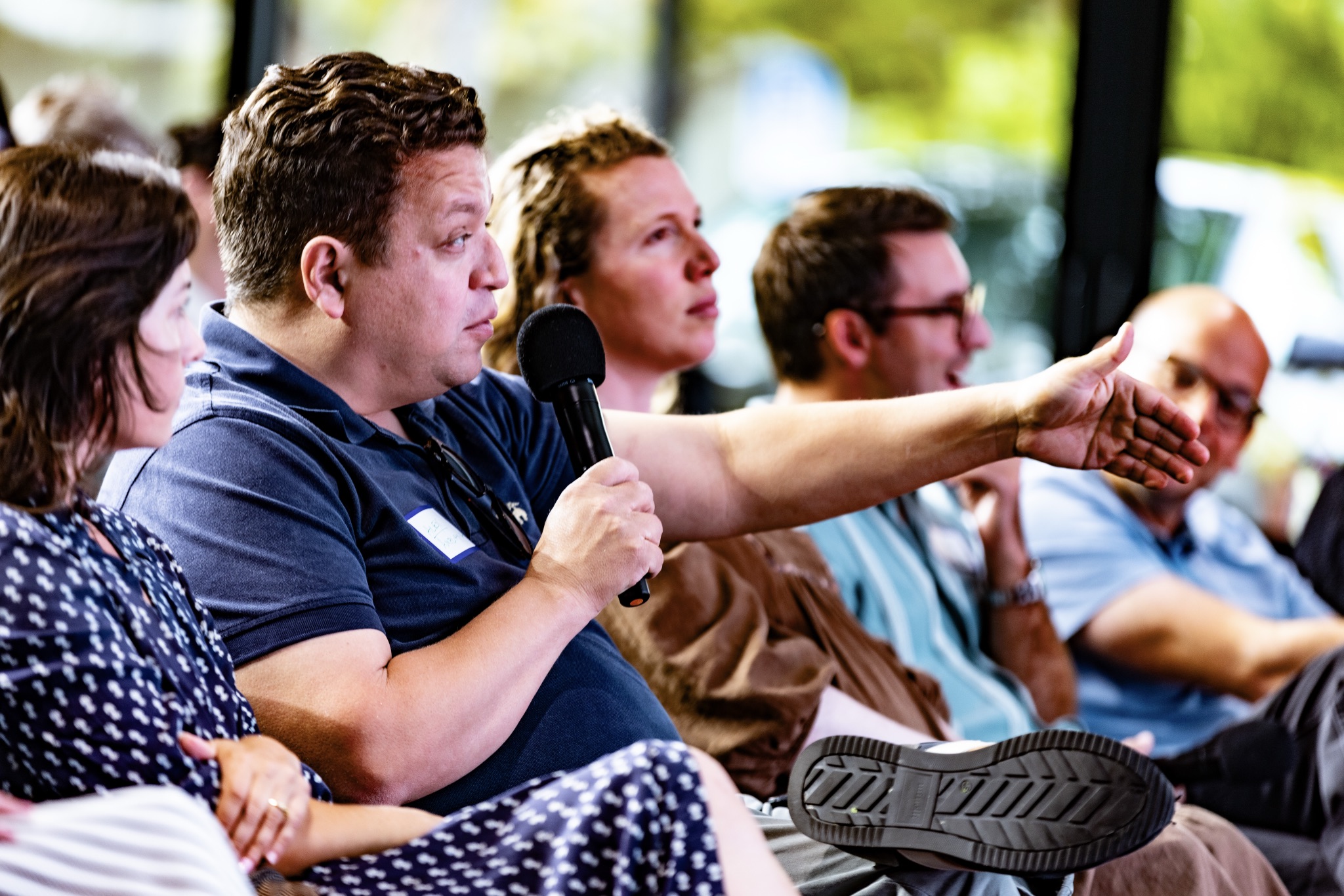 An investor gives live feedback from the audience