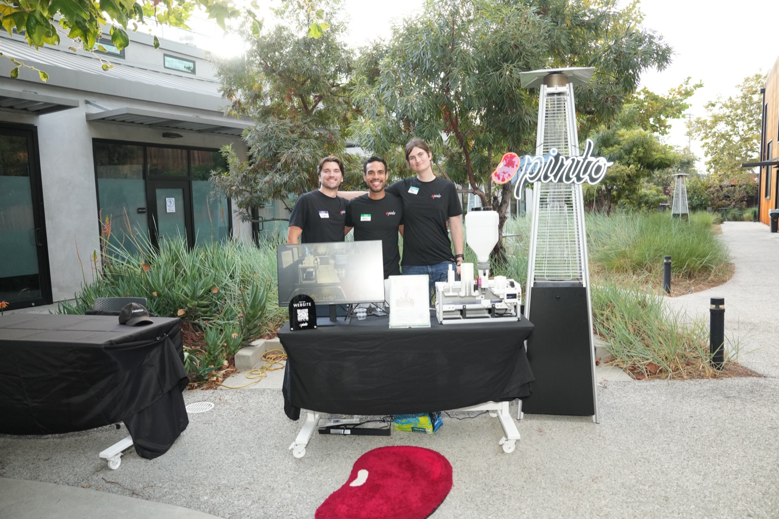 Founders at demo table showcasing their product